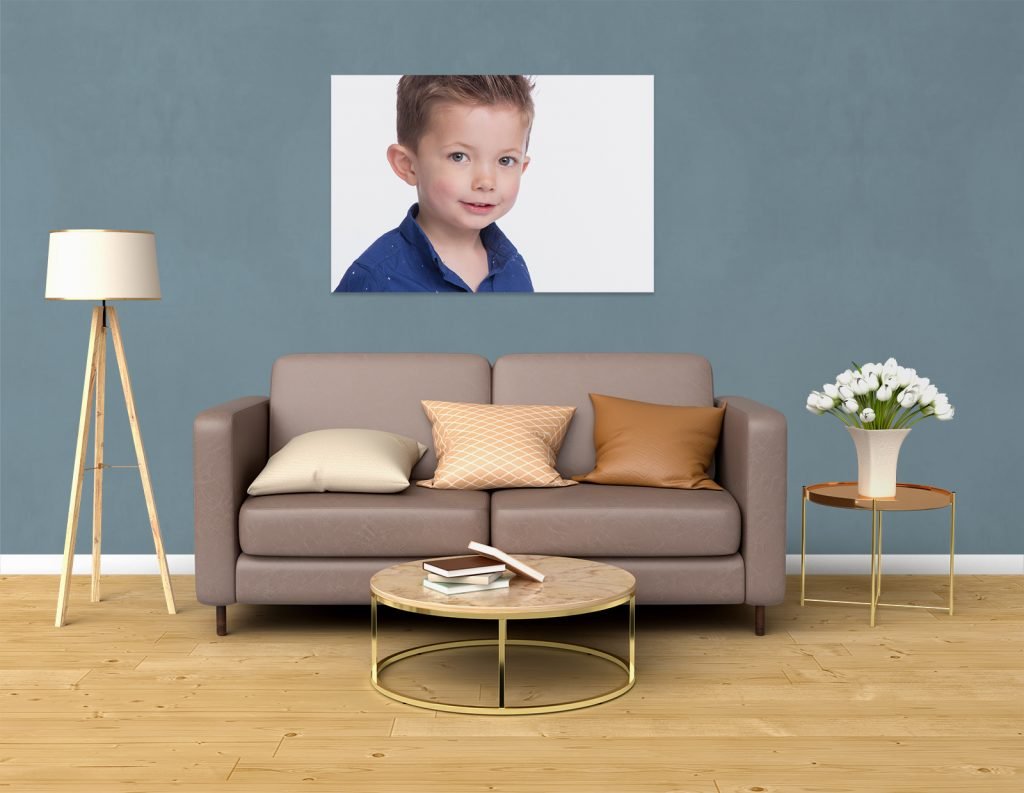 Scottish Borders Wedding Photographer. Portrait of a young boy in a blue shirt, home interior background.