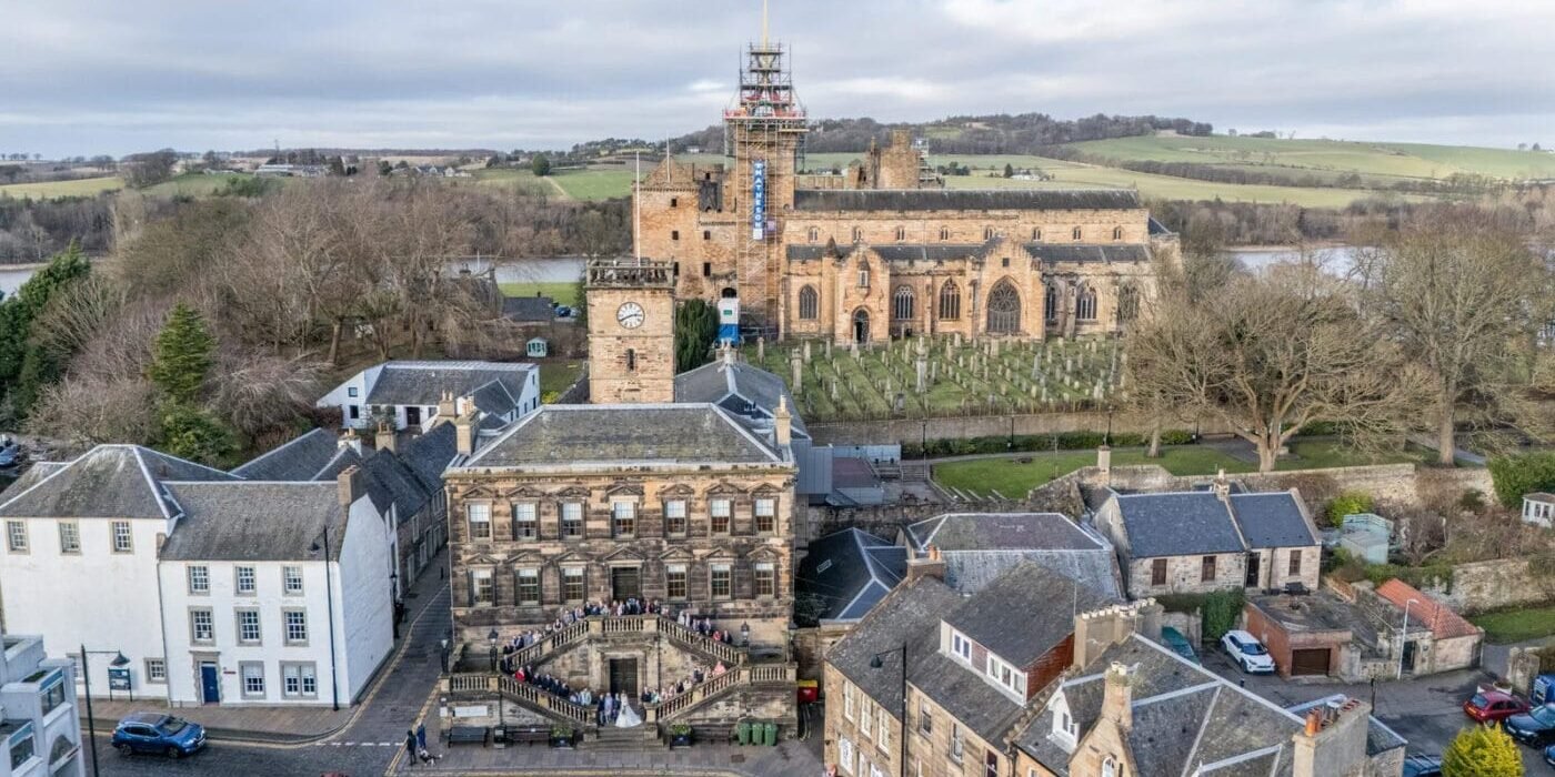 Drone Shot of the Burgh Halls with Linlithgow Palace in background