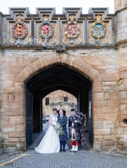 Bride and Groom at enterance to linlithgow palace