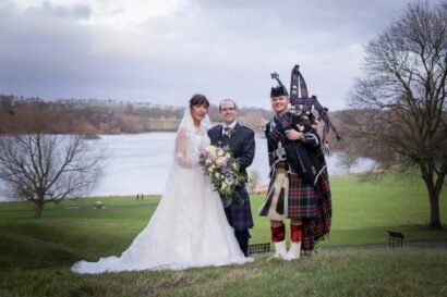 Jane, Nathaniel and James the Bagpiper photo with lake