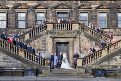 Wedding party on the external stairs at Linlithgow Burgh Halls
