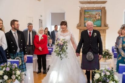 Jane walking down the aisle at Burgh Halls Linlithgow